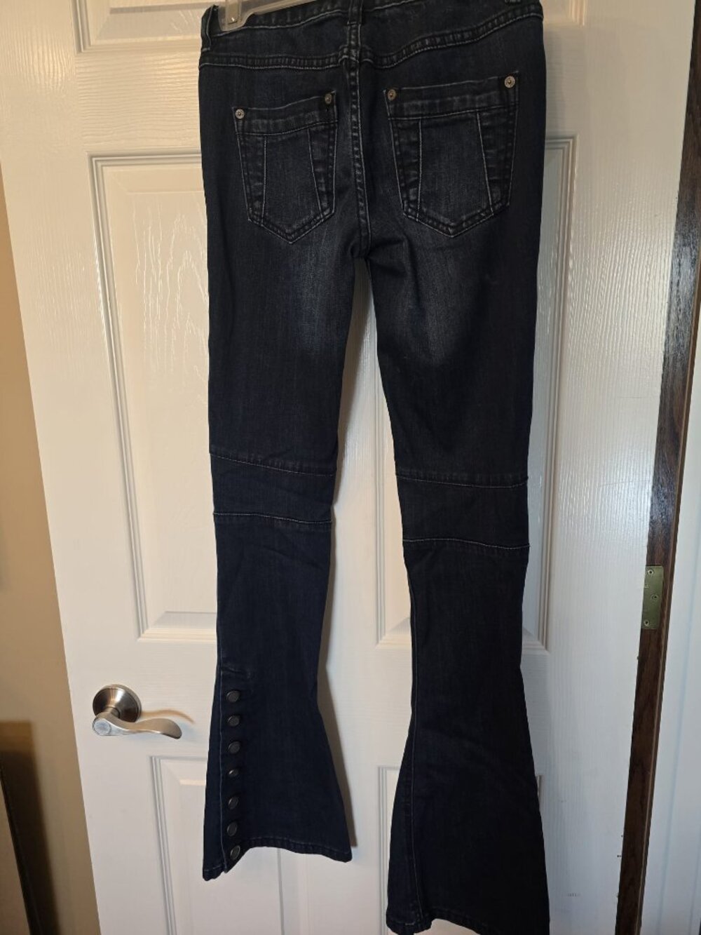 "We The Free Skylar Button Flare Jeans", "Moto paneling", and "Snap button hem"